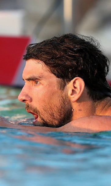 Phelps roars from last to 1st in 100 free at Arizona meet